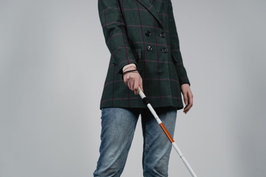 A person holding a cane